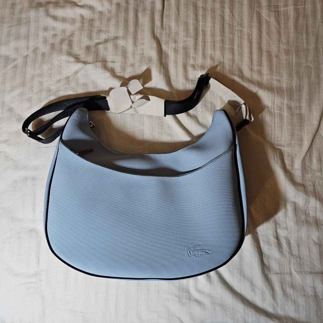 Lacoste Baby Blue Luna shaped Cross body Bag Women s Fashion Bags Wallets Cross body Bags on Carousell