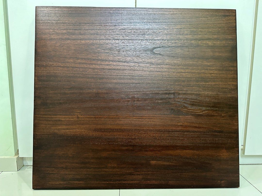 Solid Wood Tabletop (Category: Tables & Sets) located in Singapore. Submitted by hotwt (Listing ID 1283575752, Image 1). Description: Solid Wood Tabletop Maroon color 90cm by 80cm 2cm thick Reinforced with a smaller pad Holes are due to screwing to table leg, controller and tray.