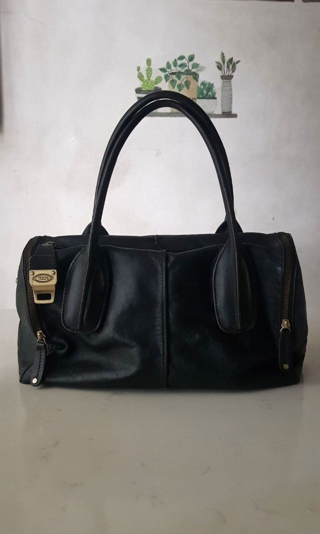 Vintage Tods D Styling Leather Bag (Category: Luxury Bags & Wallets) located in Quezon City. Submitted by happycheeeks (Listing ID 1283456596, Image 1). Description: 💯handsome in actual. All leather. Brass hardware. Can fit a lot flaws shown on pics 1. handle 2. broken turnlock 3. missing strap 14.75 inches - length 16 inches- height incl handle 6.75 inches - depth rfs decluttering manage your expectations needs cleaning, polishing of hardware s