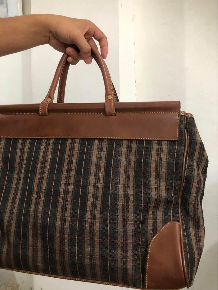 WEEKENDER BAG (Category: Luxury Bags & Wallets) located in Quezon City. Submitted by healthnfeshn (Listing ID 1283461253, Image 2). Description: Pre loved Travel Bag/Carryall Bag for sale P799. Please see picture for signs of usage..