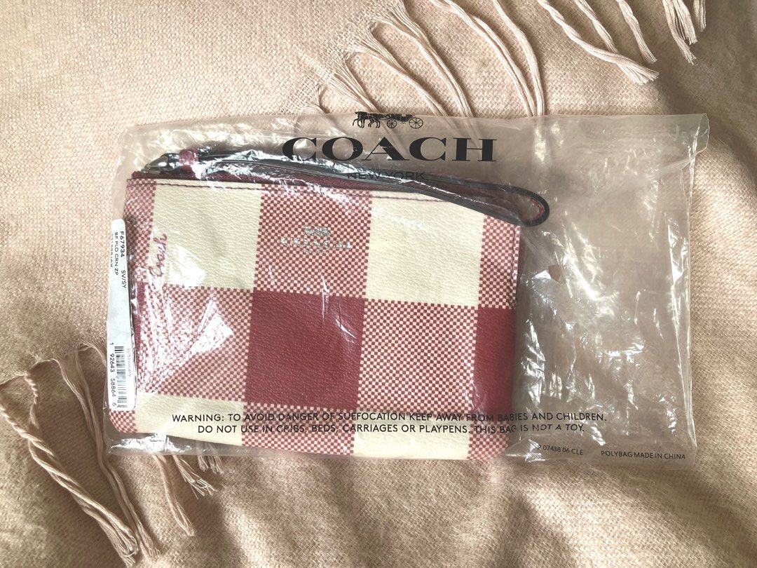 Authentic Coach Corner Zip Wristlet in Buffalo Plaid Print (Category: Wallets & Card holders) located in Quezon City. Submitted by reysiyel (Listing ID 1285914020, Image 2). Description: Authentic Coach Corner Zip Wristlet in Buffalo Plaid Print from US, completely new with tags and plastic packaging(as shown) RFS: Received as gift(s) from US relatives, I already have other Coach wristlets Selling as is, all pertinent photos shown to manage expec