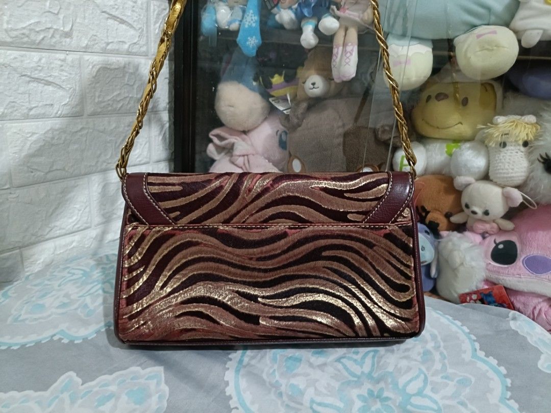 Authentic Vintage Louis Quatorze Sling Bag (Category: Shoulder Bags) located in Taguig. Submitted by edellede (Listing ID 1285904866, Image 2). Description: For Sale! Preloved Louis Quatorze sling bag not adjustable but you can remove the chain to use it as a clutch Combination of leather and velvet Dimensions are shown in photos #7 and #8 Kindly also check the last 2 photos for some minor flaws RFS: Decluttering preferably meet up but can also s