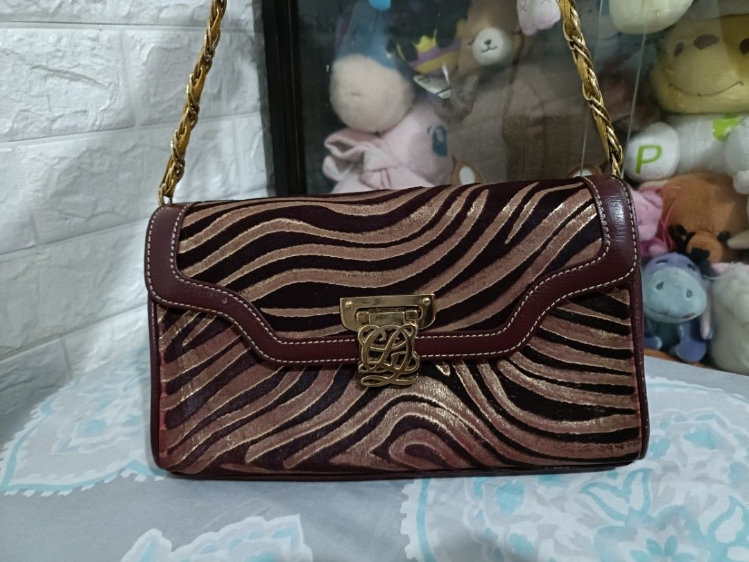 Authentic Vintage Louis Quatorze Sling Bag (Category: Shoulder Bags) located in Taguig. Submitted by edellede (Listing ID 1285904866, Image 1). Description: For Sale! Preloved Louis Quatorze sling bag not adjustable but you can remove the chain to use it as a clutch Combination of leather and velvet Dimensions are shown in photos #7 and #8 Kindly also check the last 2 photos for some minor flaws RFS: Decluttering preferably meet up but can also s