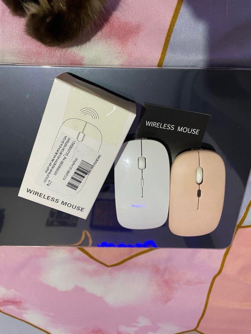 Wireless mouse set for Macbook and other lappy's (Category: Mouse & Mousepads) located in Manila. Submitted by yangyang_11 (Listing ID 1285992248, Image 2). Description: Seldom use and already upgraded to magic mouse. Works perfectly and smooth no delays (bluetooth and dongle). Get both. White and baby pink ✨ MOP: Maya/Gcash.