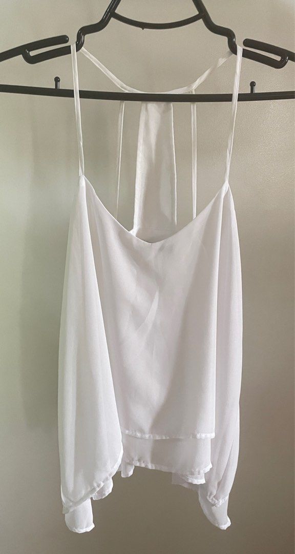 Bershka loose sleeveless top (white) (Category: Sleeveless) located in Baliuag. Submitted by allthingsambrit (Listing ID 1285856896, Image 1). Description: Issue: yellowing (see pic). I think it will come off with bleach..