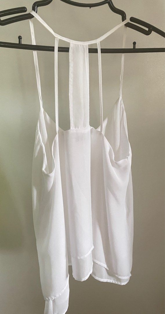 Bershka loose sleeveless top (white) (Category: Sleeveless) located in Baliuag. Submitted by allthingsambrit (Listing ID 1285856896, Image 2). Description: Issue: yellowing (see pic). I think it will come off with bleach..
