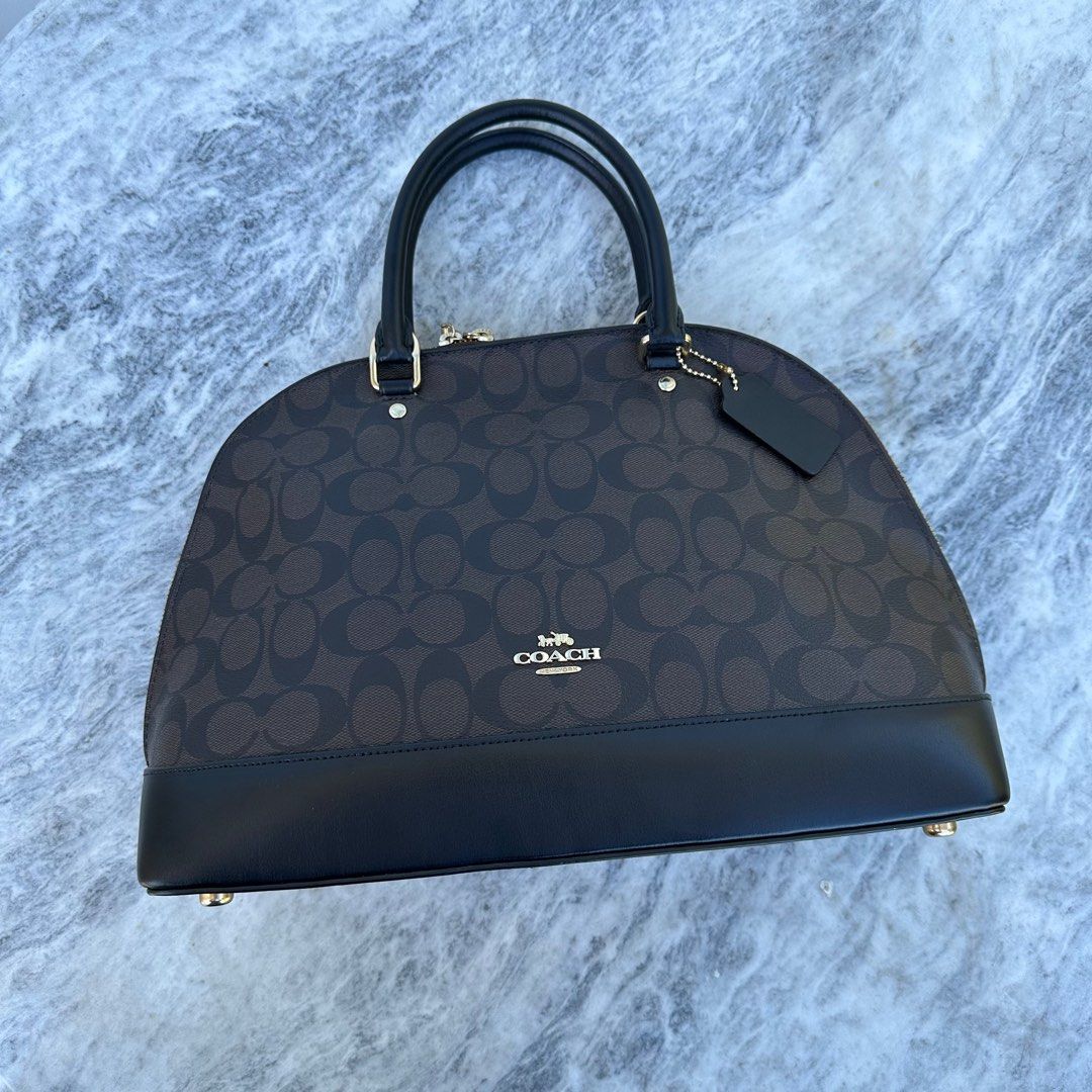 Coach Alma Large (Category: Luxury Bags & Wallets) located in Batangas. Submitted by yunamistica13 (Listing ID 1285912255, Image 1). Description: Authentic (Slightly used) Large Size With hang tag, care card, receipt Still in good condition, insides are clean, zippers are working, hardwares are still gold, the metal feet has some scratches, the major flaw is the back pocket of the bag outside, it becomes out of shape due to being stored for too l