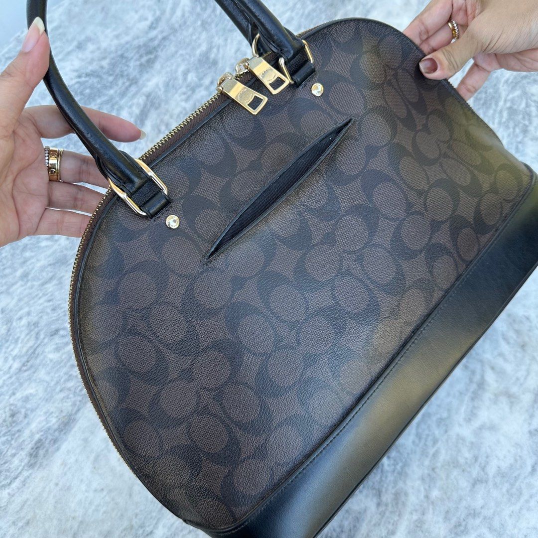 Coach Alma Large (Category: Luxury Bags & Wallets) located in Batangas. Submitted by yunamistica13 (Listing ID 1285912255, Image 3). Description: Authentic (Slightly used) Large Size With hang tag, care card, receipt Still in good condition, insides are clean, zippers are working, hardwares are still gold, the metal feet has some scratches, the major flaw is the back pocket of the bag outside, it becomes out of shape due to being stored for too l
