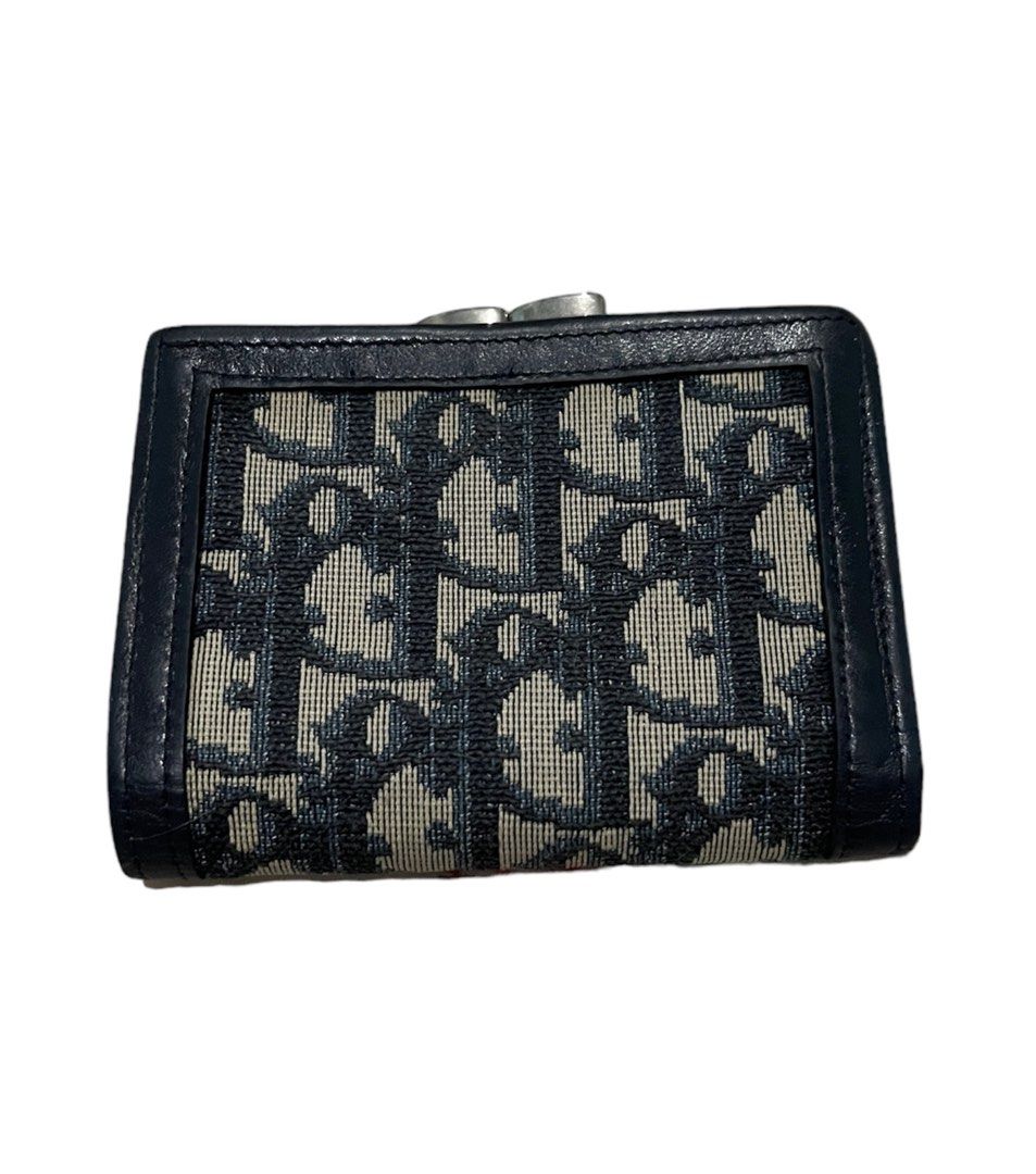 Dior compact wallet (Category: Luxury Bags & Wallets) located in Cagayan de Oro. Submitted by theclassictrunk (Listing ID 1285903705, Image 1). Description: ✅Original Christian Dior compact wallet ✅bifold kiss lock ✅with signs of use but no cracks ✅faded hardwares ✅hardwares may look like silver already ✅in very good condition ✅no inclusions.