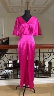 Hot pink romper jumpsuit with bell type sleeves