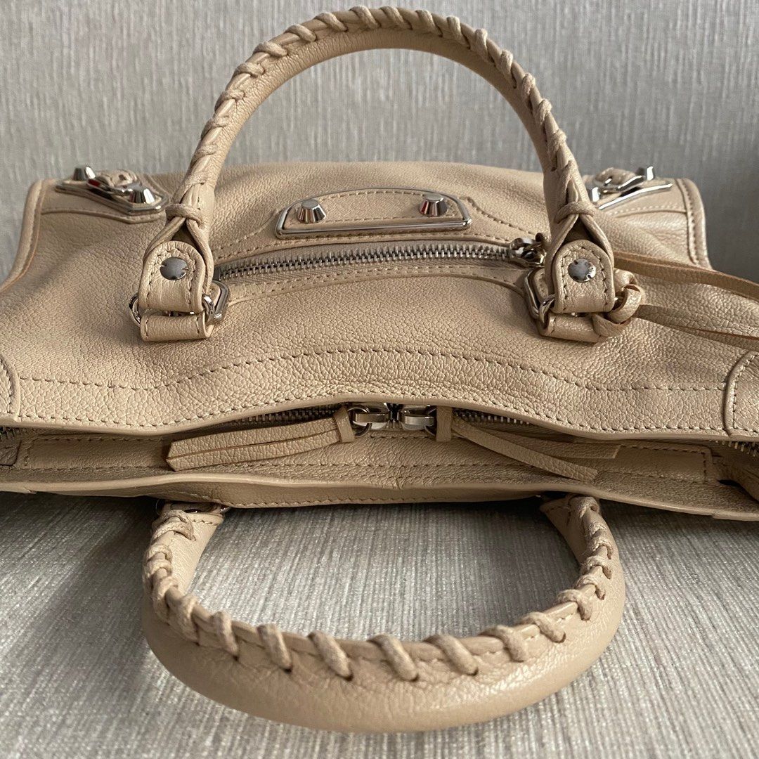 BALENCIAGA Metallic Small Edge SHW (Category: Luxury Bags & Wallets) located in Makati City. Submitted by justeprix (Listing ID 1286139103, Image 3). Description: ✅ NO ISSUES ✅ You can send a reasonable offer PRICE NEGOTIABLE DROP YOUR OFFER BUT BE REALISTIC 😉😉😉 - Beige cream-colored goatskin leather with silver hardware - Lightly used with care - Like NEW - With dust bag, bag strap, mirror and tags - RFS: Decluttering PM us for more inquiries