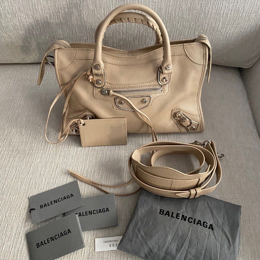 BALENCIAGA Metallic Small Edge SHW (Category: Luxury Bags & Wallets) located in Makati City. Submitted by justeprix (Listing ID 1286139103, Image 2). Description: ✅ NO ISSUES ✅ You can send a reasonable offer PRICE NEGOTIABLE DROP YOUR OFFER BUT BE REALISTIC 😉😉😉 - Beige cream-colored goatskin leather with silver hardware - Lightly used with care - Like NEW - With dust bag, bag strap, mirror and tags - RFS: Decluttering PM us for more inquiries