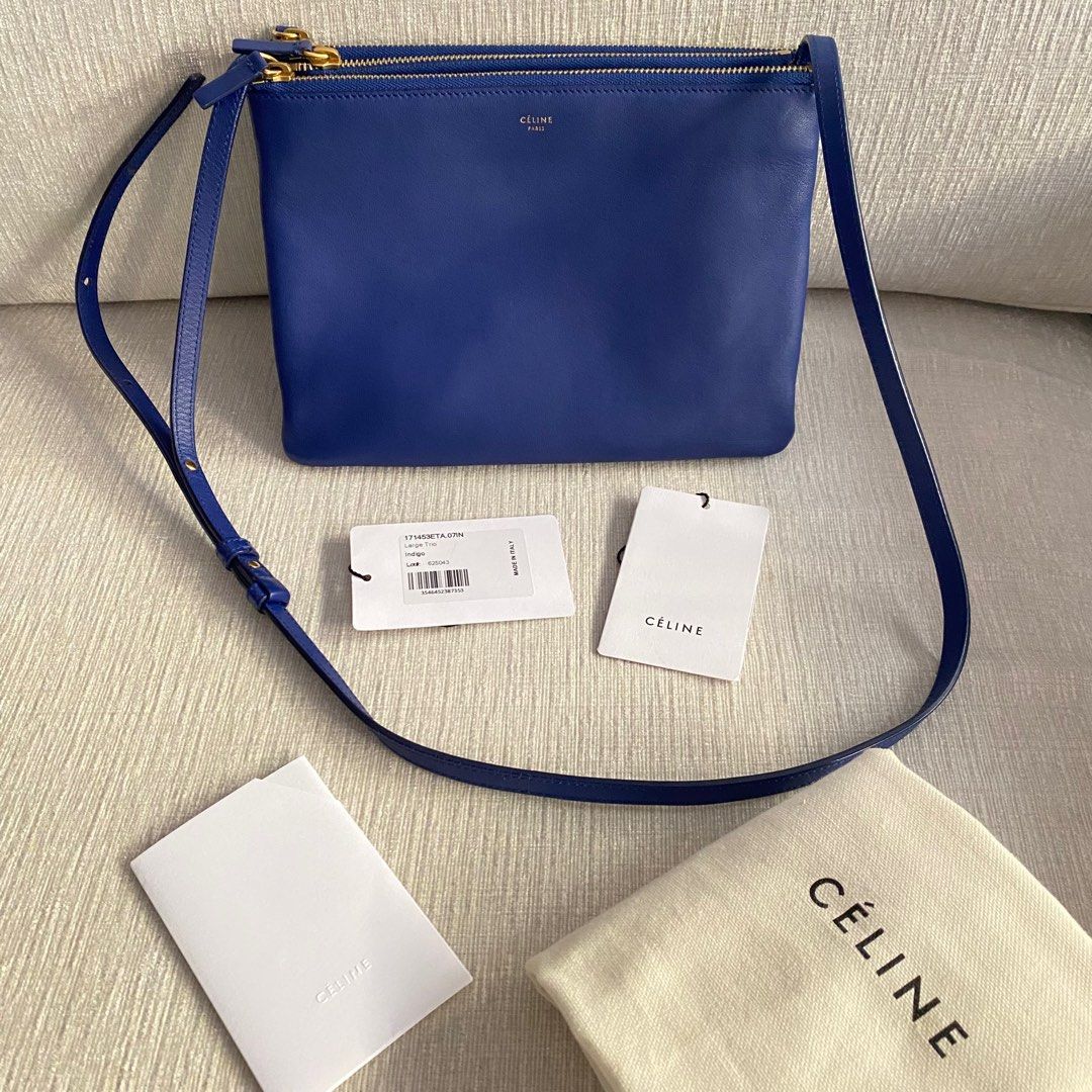 CELINE Large Trio (Category: Luxury Bags & Wallets) located in Makati City. Submitted by justeprix (Listing ID 1286138386, Image 2). Description: GUARANTEED AUTHENTIC STOP ASKING FOR A LOWER 😉😉😉 - Indigo-colored lambskin leather with gold hardware - Lightly used with care - With dust bag - RFS: Decluttering PM us for more inquiries :) — Buying pre-loved and vintage bags is the way to go! Check out our collection and let us know which one has c