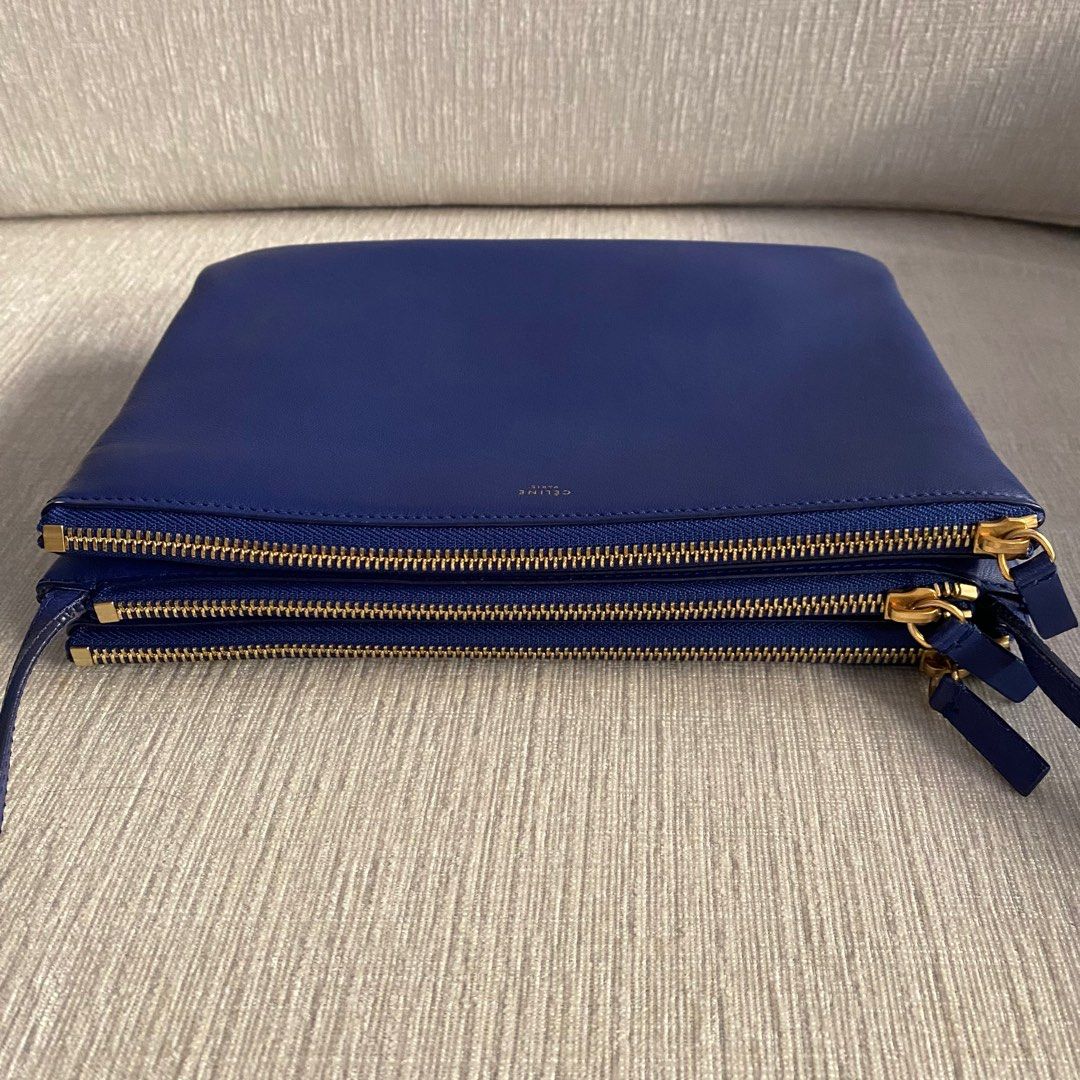 CELINE Large Trio (Category: Luxury Bags & Wallets) located in Makati City. Submitted by justeprix (Listing ID 1286138386, Image 3). Description: GUARANTEED AUTHENTIC STOP ASKING FOR A LOWER 😉😉😉 - Indigo-colored lambskin leather with gold hardware - Lightly used with care - With dust bag - RFS: Decluttering PM us for more inquiries :) — Buying pre-loved and vintage bags is the way to go! Check out our collection and let us know which one has c