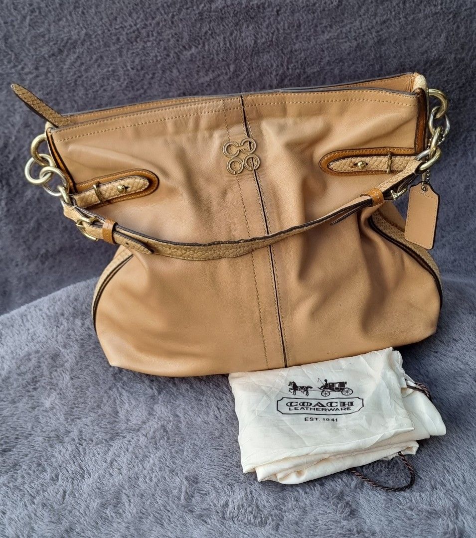 Coach Colette Hobo Bag (Category: Luxury Bags & Wallets) located in Talisay. Submitted by parchiracollection (Listing ID 1286088483, Image 1). Description: *With Coach dust bag * Please check photos thoroughly before purchasing *has some scratches/scuffs on the leather part *plus SF *size already indicated on the picture * This is a second-hand item, kaya wag po mag expect na BAGO *no to low ballers. The discounted price I'll give is the final pr