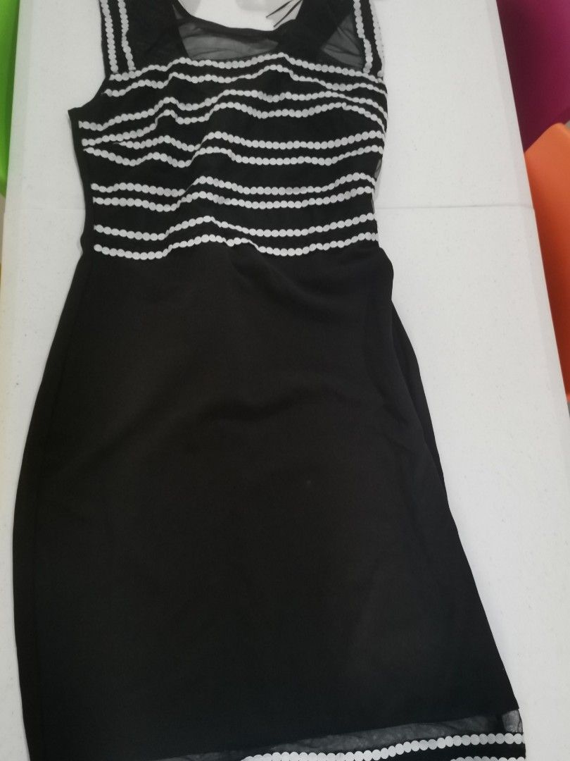 Black short sleeve dress (Category: Dresses) located in Quezon City. Submitted by random-11731 (Listing ID 1286225820, Image 1). Description: , 👍Used few times only. 👍 👍Bought in London 👍Can fit small to medium 👍Brand names. Lipsy London.