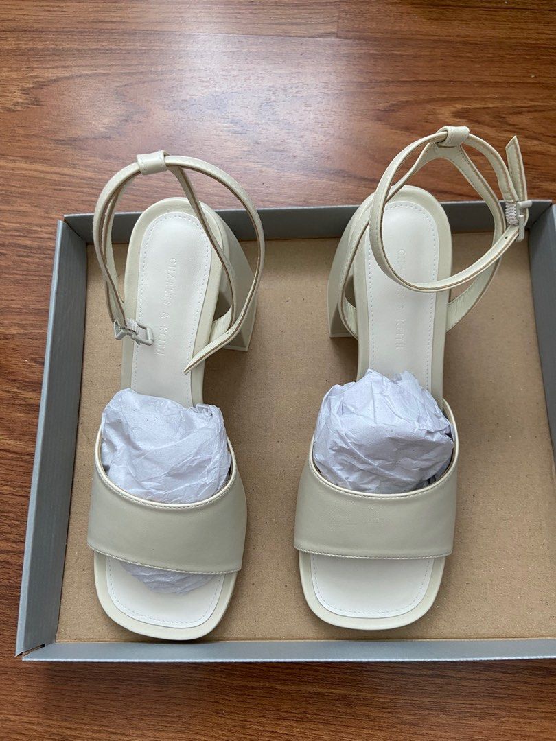 Charles and Keith: Chunky Block Heel Sandals (Category: Heels) located in Manila. Submitted by auriellee (Listing ID 1286210412, Image 2). Description: NEVER USED! With box - perfect for events / weddings Color: Chalk Rounded square toes Adjustable ankle straps Chunky block heels Breathable lining Material: Faux leather Heel height (cm): 8 RFS: ended up using a different pair of shoes on my wedding :D.