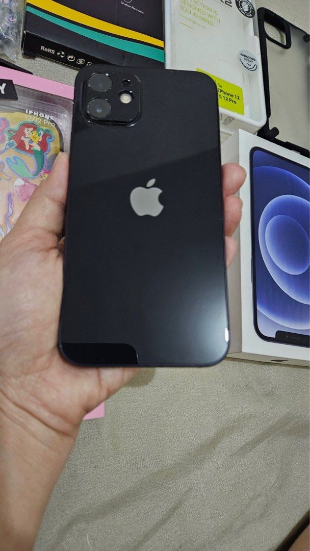 Iphone 12 128gb Lady Owned with box Openline (Category: iPhone 12 Series) located in Caloocan City. Submitted by jane_maze (Listing ID 1286317682, Image 2). Description: Iphone 12 128gb 95% smooth With super minimal hairline scratches Lady owned Same Serial number box and unit With cases Orig casetify disney case No issues Test all you want With box charger Meetup: sm north, trinoma Rfs: upgrade.