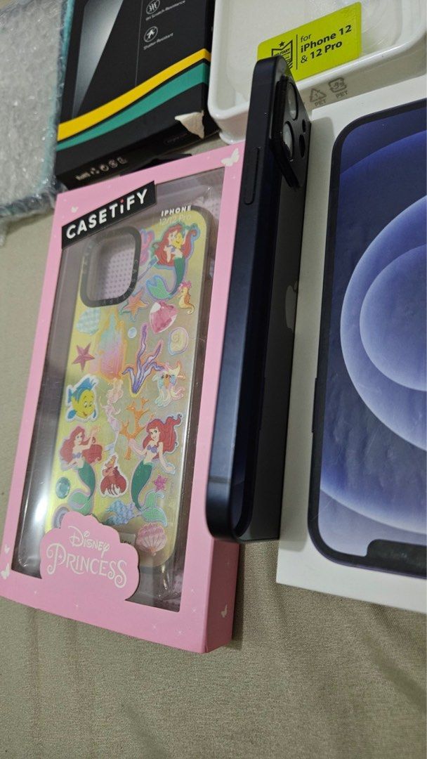 Iphone 12 128gb Lady Owned with box Openline (Category: iPhone 12 Series) located in Caloocan City. Submitted by jane_maze (Listing ID 1286317682, Image 3). Description: Iphone 12 128gb 95% smooth With super minimal hairline scratches Lady owned Same Serial number box and unit With cases Orig casetify disney case No issues Test all you want With box charger Meetup: sm north, trinoma Rfs: upgrade.
