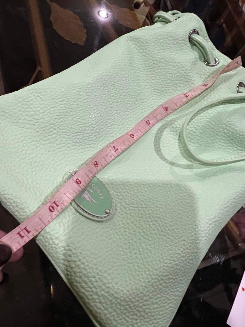 On sale Authentic Lacoste bucket bag (Category: Luxury Bags & Wallets) located in Paranaque City. Submitted by FLess.ph (Listing ID 1286186164, Image 2). Description: Brand new and authentic. Comes with lacoste paper bag. Guaranteed authentic. I don't sellfake knock off items .
