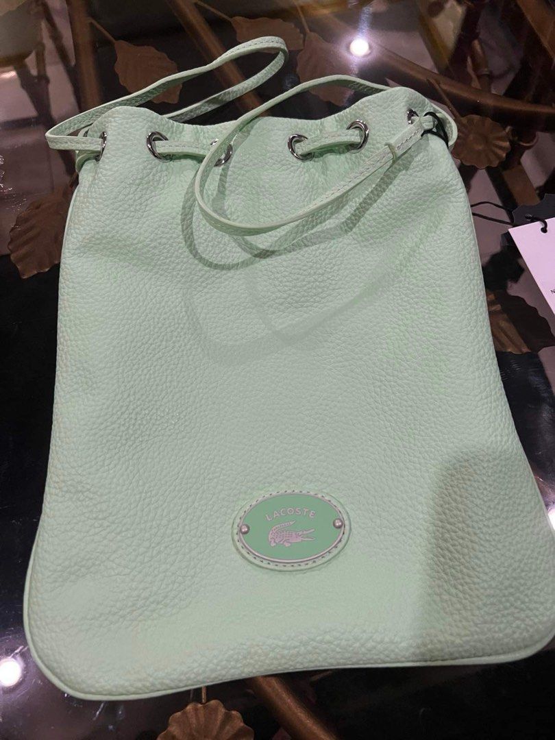 On sale Authentic Lacoste bucket bag (Category: Luxury Bags & Wallets) located in Paranaque City. Submitted by FLess.ph (Listing ID 1286186164, Image 1). Description: Brand new and authentic. Comes with lacoste paper bag. Guaranteed authentic. I don't sellfake knock off items .