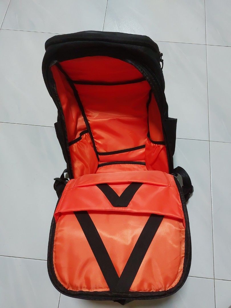 Backpack (Category: Backpacks) located in Singapore. Submitted by lostlightz (Listing ID 1286576340, Image 3). Description: Brand new backpack. Bought but not used as other bags received from gift. Slick black and nice orange. Comes with a raincover, and able to fit up to 15.6inch laptop. Letting go cheap, as I have other backpacks..