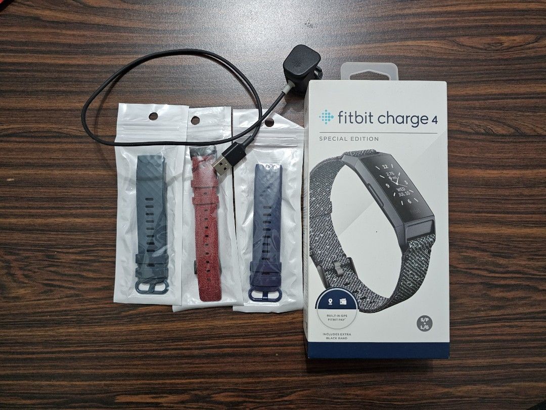 Fitbit charge 4 straps brand new charger and empty box