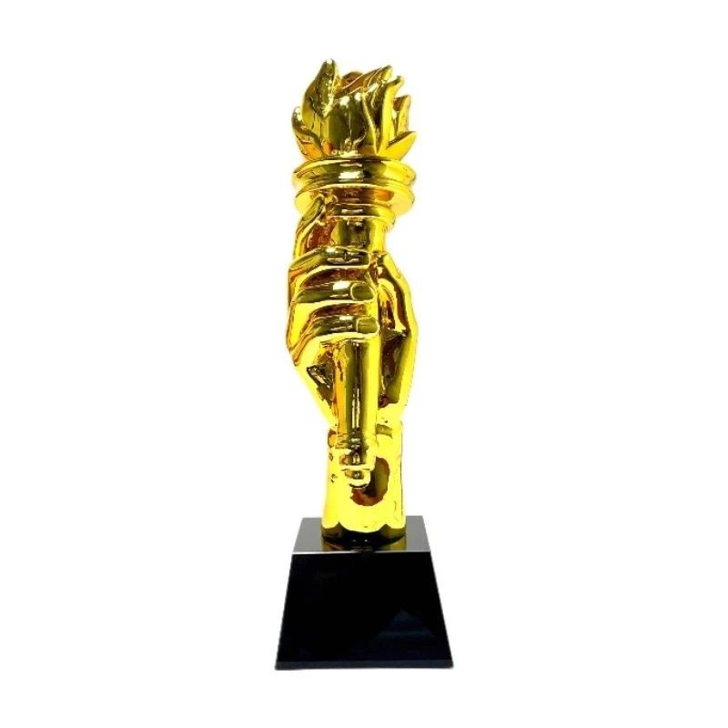 Torch Crystal Trophy (Category: Other Sports Equipment and Supplies) located in Manila. Submitted by ariesmediamusicsports (Listing ID 1286516618, Image 3). Description: This elegant trophy features a captivating design with a resin figure holding a torch aloft. The torch symbolizes enlightenment, progress, and leadership. The figure, coated in a lustrous gold finish, exudes a sense of accomplishment and triumph. The trophy stands at a height of 