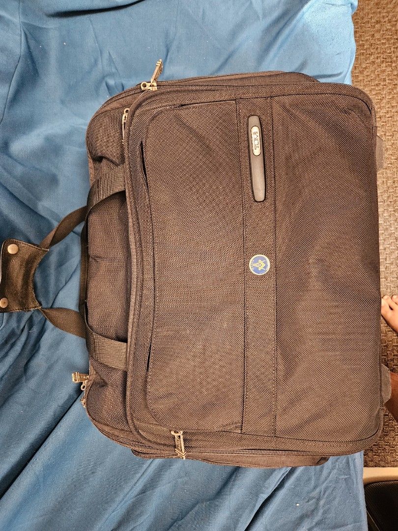 TUMI ALPHA 2 WHEELED brief (Category: Briefcases) located in Paranaque City. Submitted by tigerbomb (Listing ID 1286498385, Image 1). Description: -In good condition. -Preowned with signs of travel wear and tear from normal use, including: minimL scratches from right side -All zippers work and move smoothly. No tears or deep damage to fabric or leather. issue: left wheel damage Price is negotiable for sure buyer Please see pictures for best detai