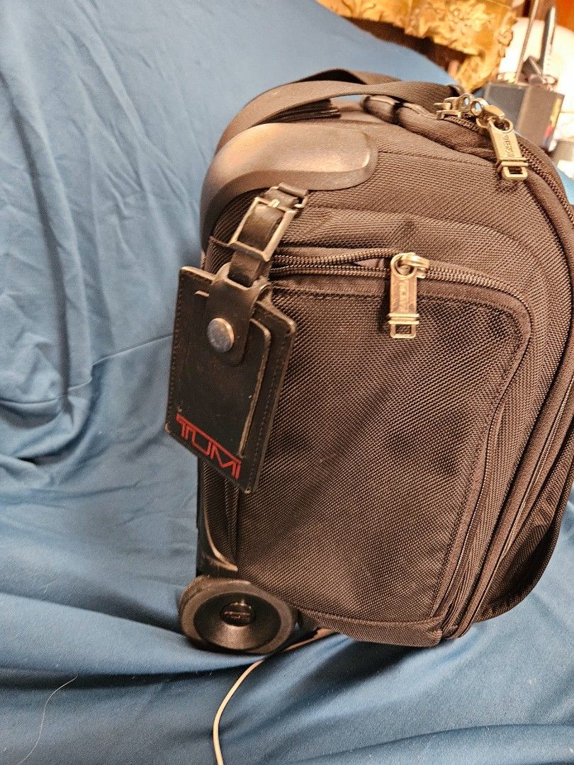 TUMI ALPHA 2 WHEELED brief (Category: Briefcases) located in Paranaque City. Submitted by tigerbomb (Listing ID 1286498385, Image 3). Description: -In good condition. -Preowned with signs of travel wear and tear from normal use, including: minimL scratches from right side -All zippers work and move smoothly. No tears or deep damage to fabric or leather. issue: left wheel damage Price is negotiable for sure buyer Please see pictures for best detai