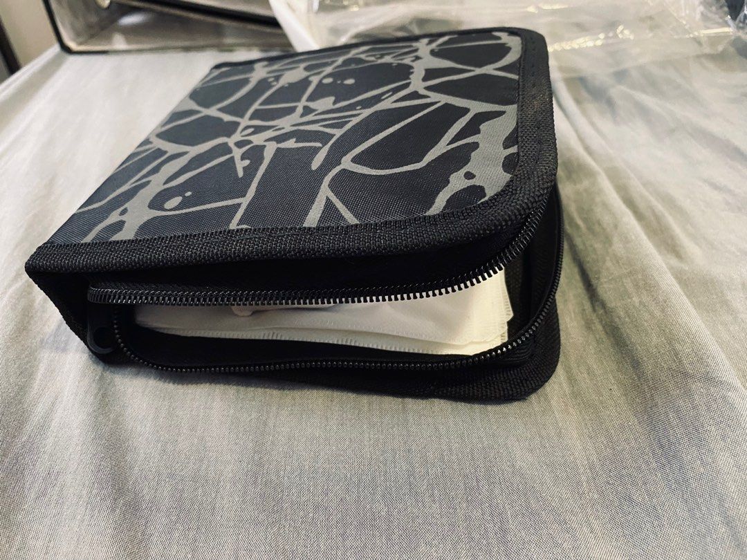 CD organizer black (Category: CDs & DVDs) located in Quezon City. Submitted by flatfootedmd (Listing ID 1286982983, Image 2). Description: Unused CD organizer black with graphic design. Can hold up to 15 CDs inside.