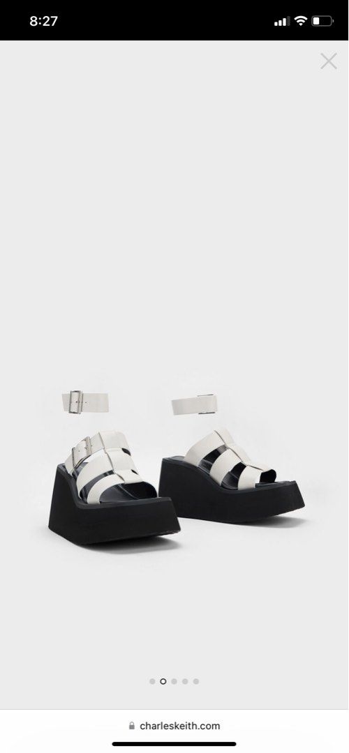 Charles and Keith Caged Wedge Sandals in White (Category: Wedges) located in Quezon City. Submitted by clt.2020 (Listing ID 1286936726, Image 1). Description: Authentic Charles and Keith Caged Wedge Sandals in White Bought for 4,200 Size 37 Used Twice in Bangkok Still looks brand new. No scuffing etc. with box .