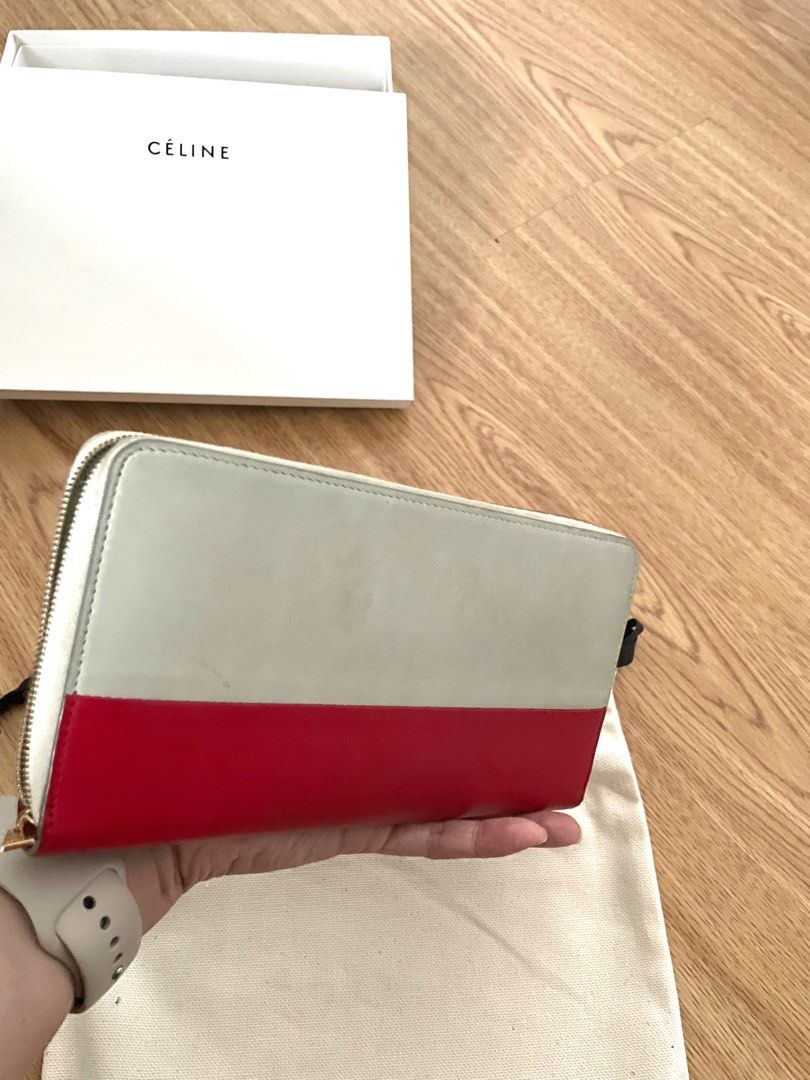 Céline bicolor long wallet (Category: Luxury Bags & Wallets) located in Pasig City. Submitted by mrsdarcy03 (Listing ID 1287055791, Image 2). Description: Preloved and authentic Céline bicolor zip wallet in grey and red combo. Comes with original box, dust bag and cards. Well used as this was one of my favorite wallets Bought in Homme et Femme, Shangri-La. Selling low! No low ballers please .