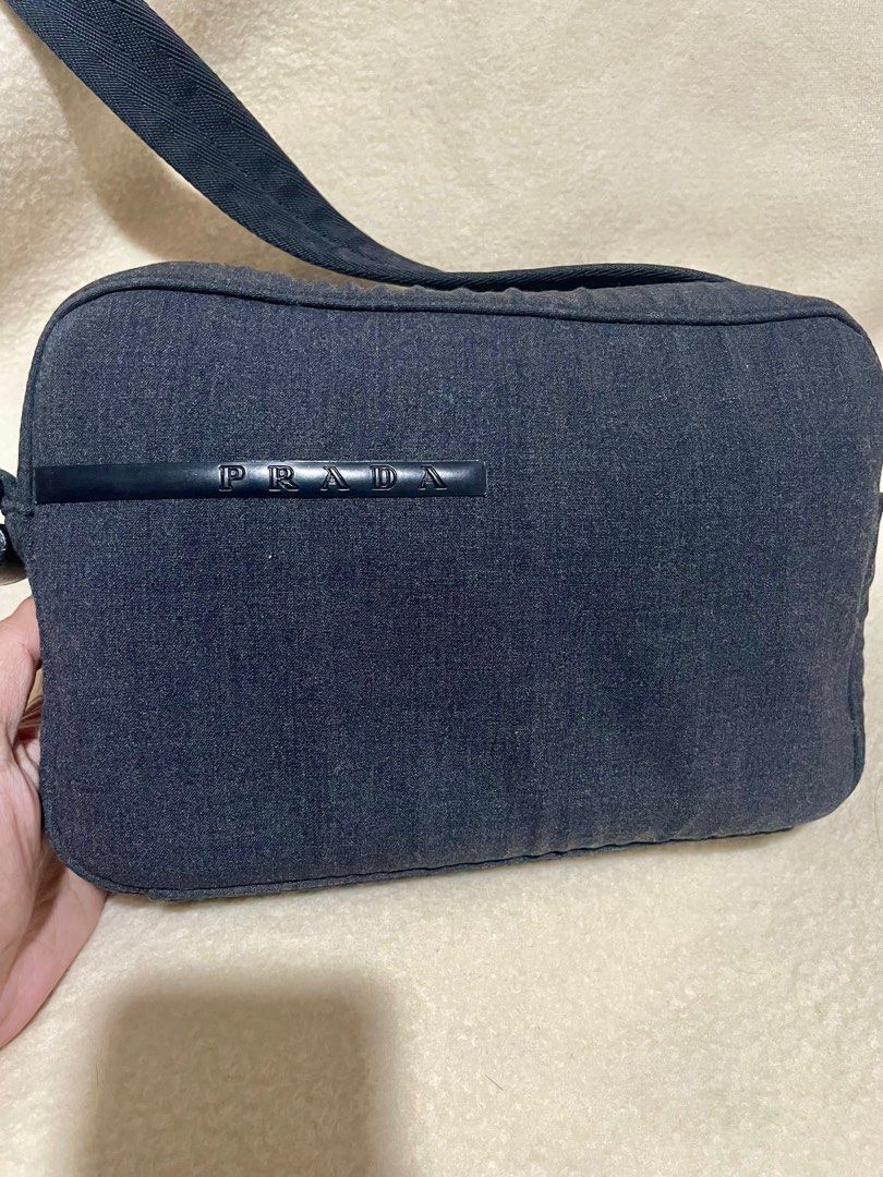 Authentic PRADA wool shoulder bag (Category: Luxury Bags & Wallets) located in San Pablo. Submitted by prelovedbymistyblue (Listing ID 1287020121, Image 3). Description: Authentic Prada Shoulder bag. Made up of wool. No major flaws except for minimal rubs on the wool on the left side (zipper area). With mapo zipper on the pocket zip and bulldog zipper on the main zip. With white tags. Sourced from Japan. Measures 9.5 x 6.2 x 2.2 inches. Selling l