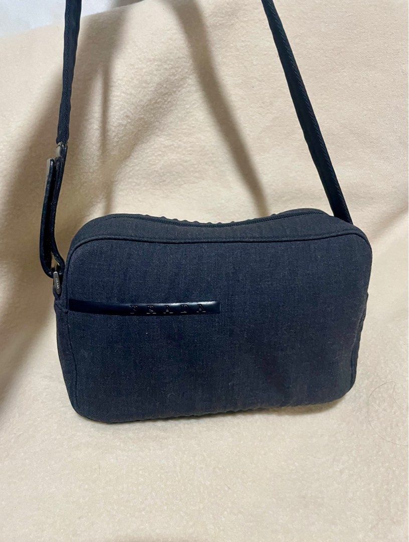 Authentic PRADA wool shoulder bag (Category: Luxury Bags & Wallets) located in San Pablo. Submitted by prelovedbymistyblue (Listing ID 1287020121, Image 1). Description: Authentic Prada Shoulder bag. Made up of wool. No major flaws except for minimal rubs on the wool on the left side (zipper area). With mapo zipper on the pocket zip and bulldog zipper on the main zip. With white tags. Sourced from Japan. Measures 9.5 x 6.2 x 2.2 inches. Selling l