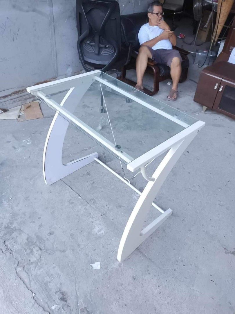 Computer table (Category: Tables & Sets) located in Quezon City. Submitted by matetdevis13 (Listing ID 1287259889, Image 3). Description: Modern glass top computer table Price : 4700 32L x 20W x 30H inches In good condition Code akc 570.