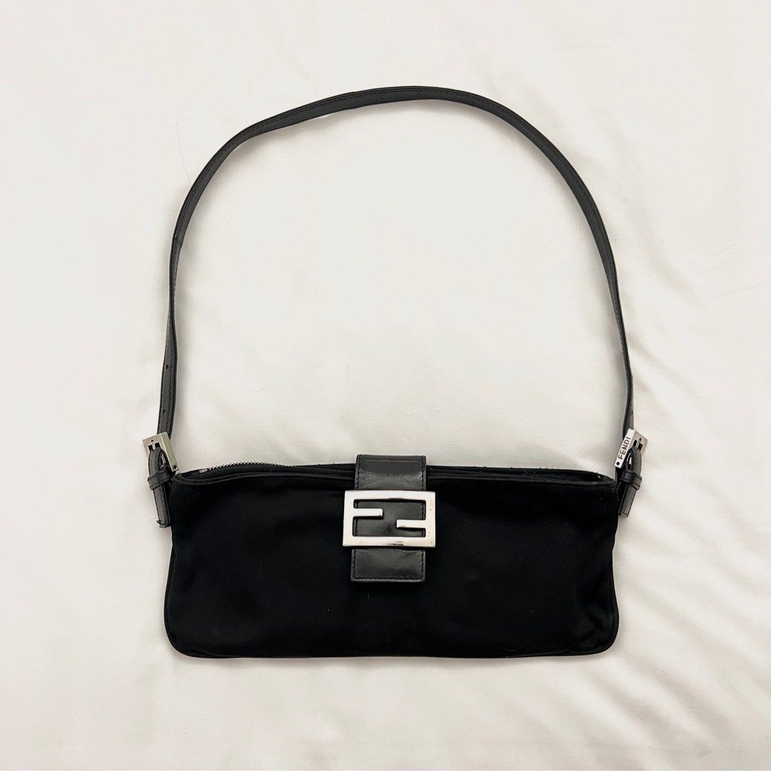 FENDI Baguette (Category: Luxury Bags & Wallets) located in Binan City. Submitted by lovedbynins (Listing ID 1287183287, Image 1). Description: Credit card straight payment accepted! (Within Laguna area only) Authentic Fendi Black Baguette, can be used as a fanny pack or shoulder bag. Used only a few times. Kindly message me for the bag’s code. No inclusion. Please view and zoom in all photos for details. .