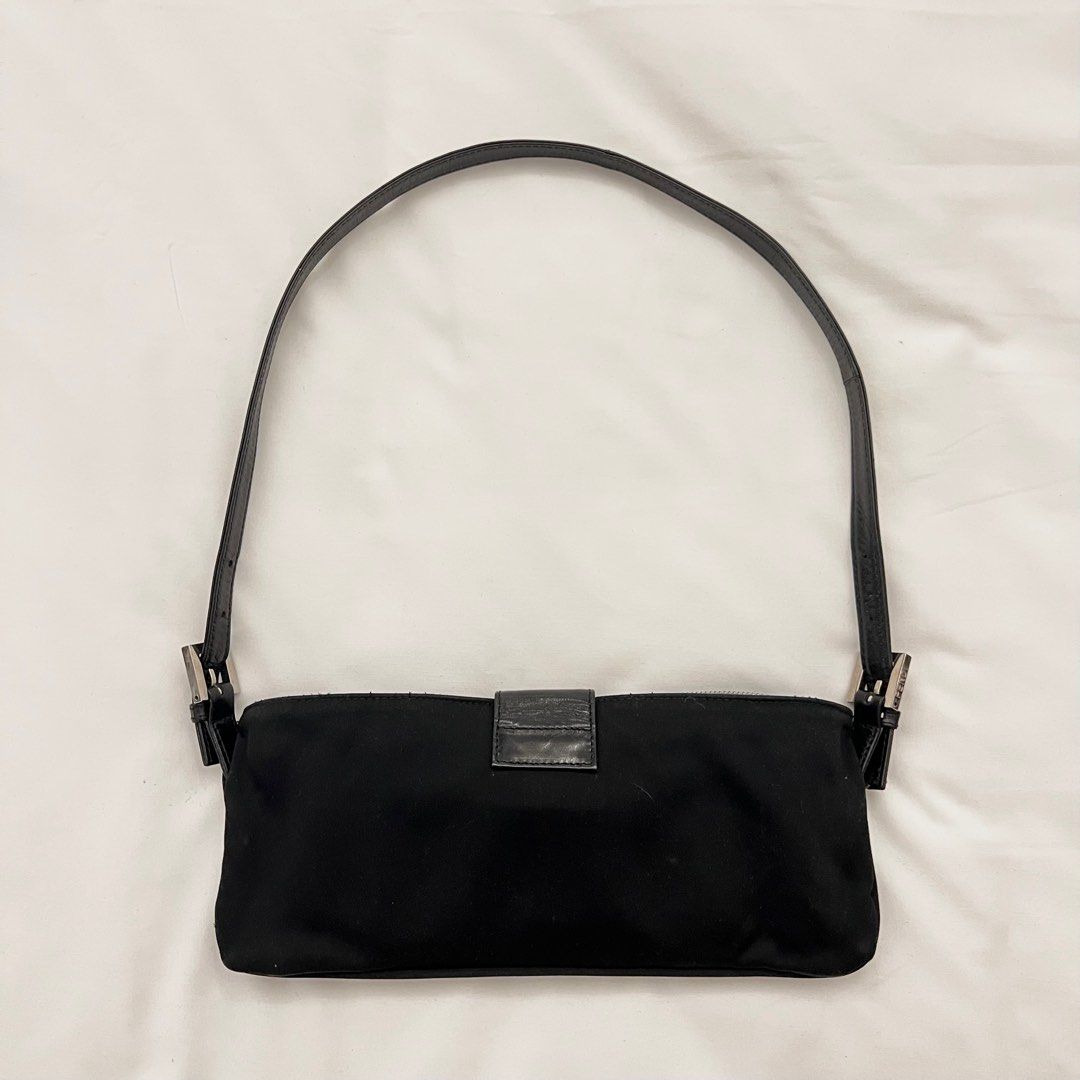 FENDI Baguette (Category: Luxury Bags & Wallets) located in Binan City. Submitted by lovedbynins (Listing ID 1287183287, Image 3). Description: Credit card straight payment accepted! (Within Laguna area only) Authentic Fendi Black Baguette, can be used as a fanny pack or shoulder bag. Used only a few times. Kindly message me for the bag’s code. No inclusion. Please view and zoom in all photos for details. .
