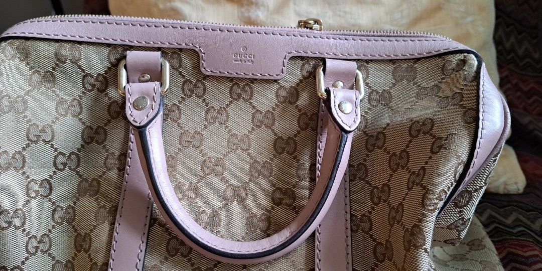 Gucci Pink Boston Bag (Category: Shoulder Bags) located in Makati City. Submitted by mpcillan (Listing ID 1287296288, Image 1). Description: selling really low as I need to declutter...Gucci Boston bag with handles and long strap. Almost new except for unnoticeable scratch in the bottom corner. Free delivery if within NCR.