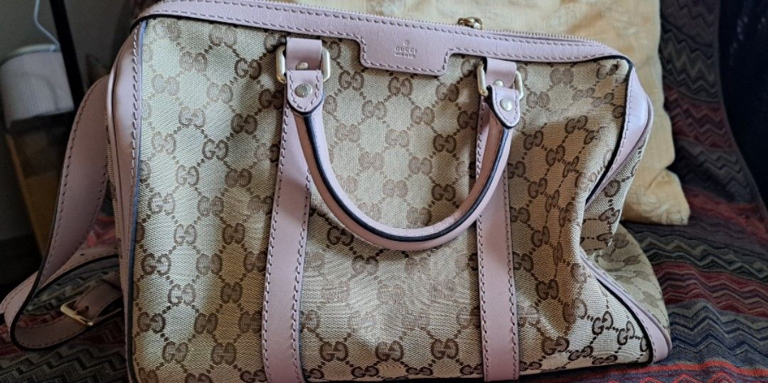 Gucci Pink Boston Bag (Category: Shoulder Bags) located in Makati City. Submitted by mpcillan (Listing ID 1287296288, Image 2). Description: selling really low as I need to declutter...Gucci Boston bag with handles and long strap. Almost new except for unnoticeable scratch in the bottom corner. Free delivery if within NCR.