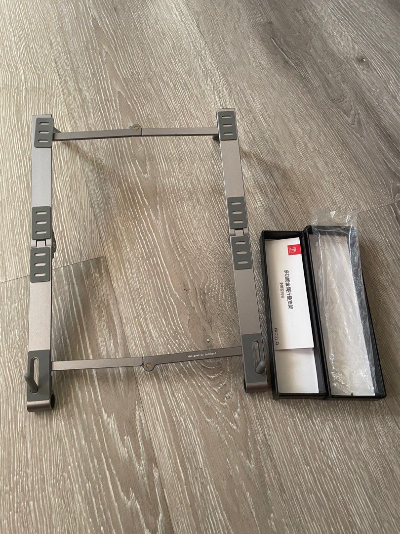 Laptop Tablet Foldable Metal Stand (Category: Laptop Bags & Sleeves) located in Bacoor. Submitted by milesgm (Listing ID 1287174164, Image 1). Description: originally bought for ₱799, never used aluminum compact laptop or tablet stand. very sturdy and won’t be easily moved. comes with box as pictured RFS: declutterring.