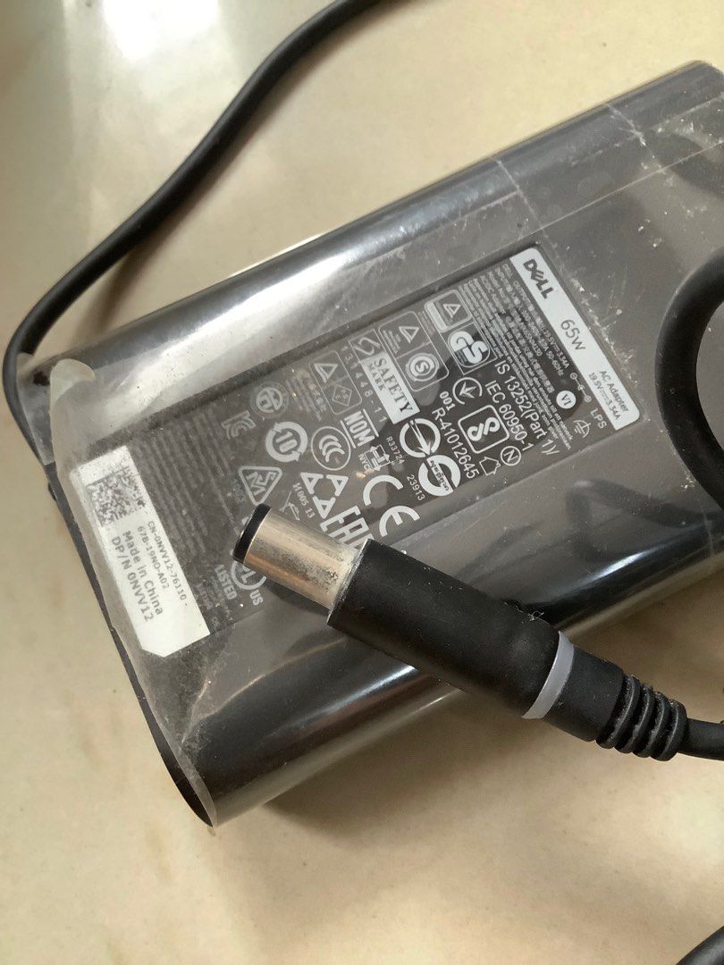 Original Dell Laptop Charger 65w (Category: Chargers) located in Manila. Submitted by purplemodel (Listing ID 1287287091, Image 3). Description: Extra unit Hindi nagamit Naalikabukan na lang sa taguan Pick up to check Selling as is San andres manila Thank you!.