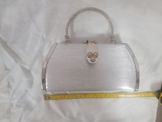 Silver Clutch Bag with handle that can also be kept hidden A095