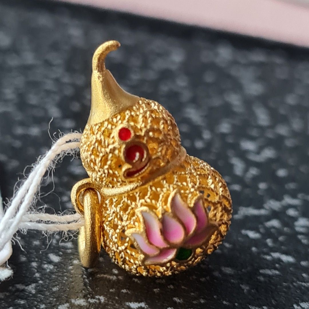 Gold lotus clearance charm