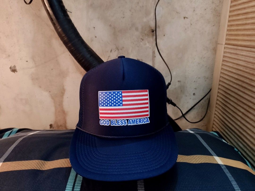 God Bless America, Adjustable Trucker Snapback Cap Hat (Category: Caps & Hats) located in San Mateo. Submitted by JmThriftCap_Ph (Listing ID 1287349939, Image 1). Description: PLEASE READ THE DESCRIPTION 👇 *Excellent Condition *American Flag & God Bless America Printed Design *Unbranded *Adjustable Snapback *Trucker Hat/Net Cap *Adult Size Fits All *Structured Foam Crown *Deep Fitting *8 Stitches Brim *10/10 Color Rate *Navy Blue Color *100% Pol