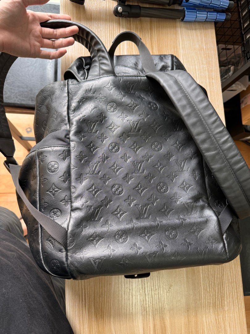 Louis vuitton leather backpack 2025