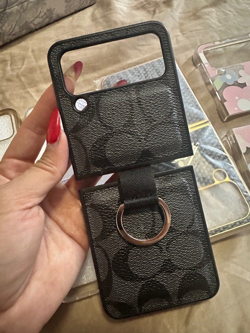 Samsung z flip 4 CASE (Category: Cases & Sleeves) located in Cainta. Submitted by jtc23 (Listing ID 1287342283, Image 2). Description: Coach - 1k Prada- 800 2 clear case - 300 each Flower -250.