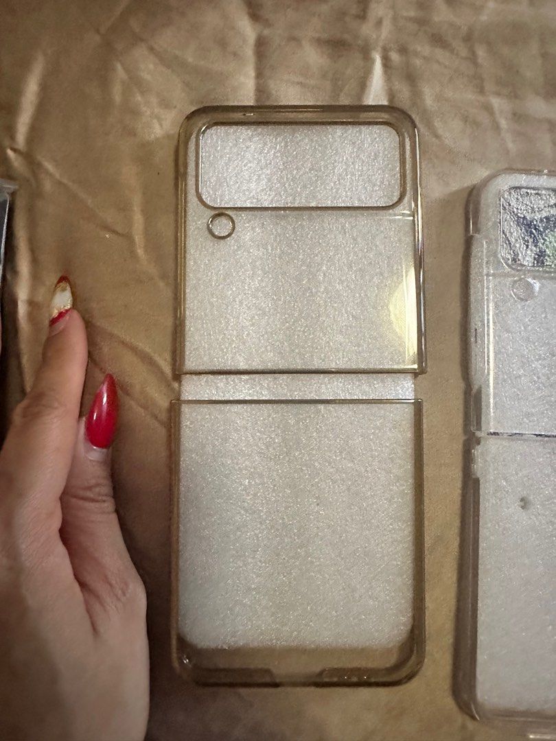 Samsung z flip 4 CASE (Category: Cases & Sleeves) located in Cainta. Submitted by jtc23 (Listing ID 1287342283, Image 3). Description: Coach - 1k Prada- 800 2 clear case - 300 each Flower -250.