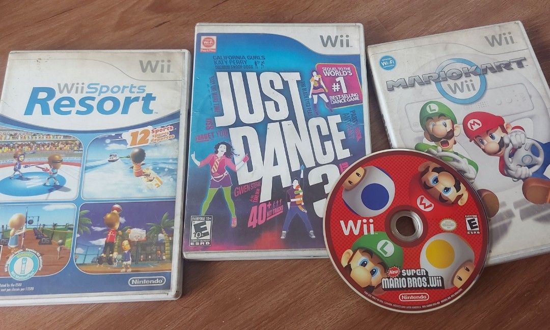Wii CD set of 4 (Category: Nintendo) located in Valenzuela. Submitted by wammiboy (Listing ID 1287359661, Image 1). Description: Wii Sports Resort Super Mario Bros Wii, CD only. Mario Kart Just Dance 3 All CDs makinis and no issues. RFS Decluttering. set sale only..