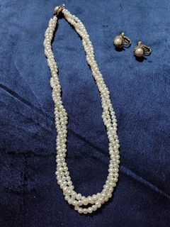 Faux Pearl necklace and earrings set.